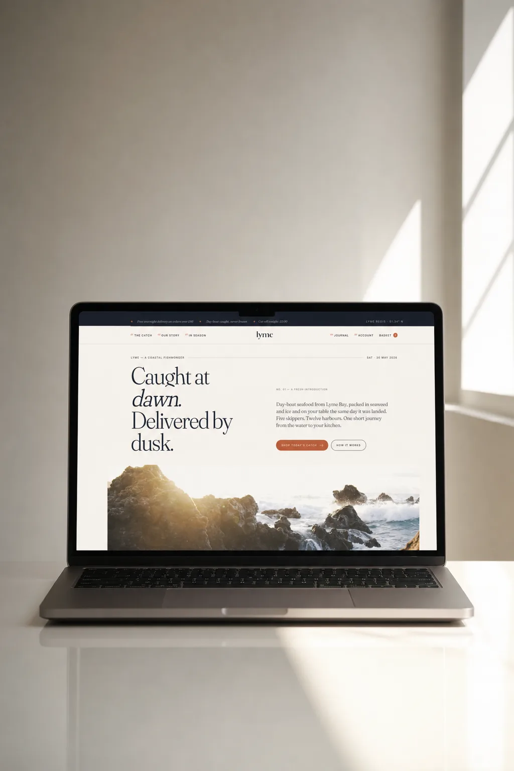 Website design shown on a laptop